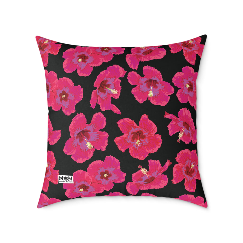 Decorative pillow with pink floral pattern on a black background